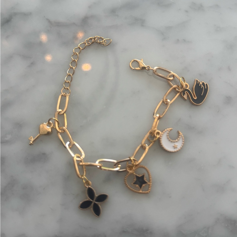 Gold Charm Bracelet with Black and White Accents